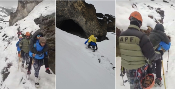 बर्फबारी में फंसे पर्यटकों का उद्धार करते पुलिस वाले