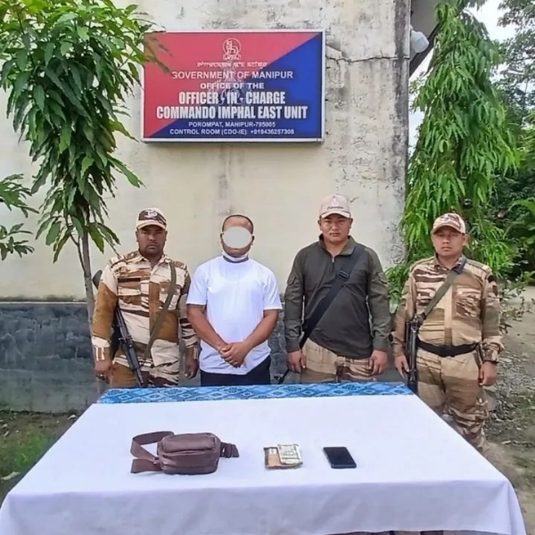 Image of the arrested rebel and seized arms and explosives in Manipur.