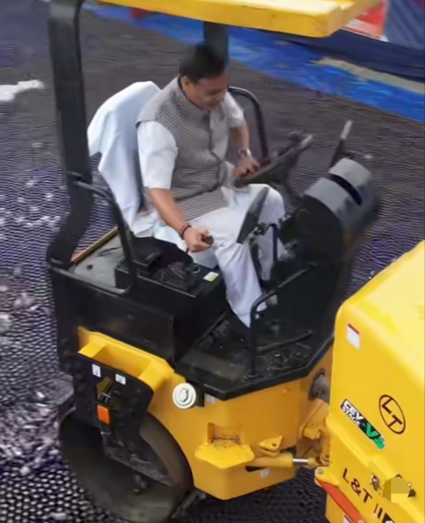 CM Dr Himanta Biswa Sarma Operating The Roller to Crush Illicit Liquor in Nalbari on Sunday.
